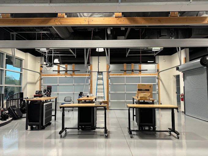 Full-view glass sectional doors in a commercial workshop in Riverside County