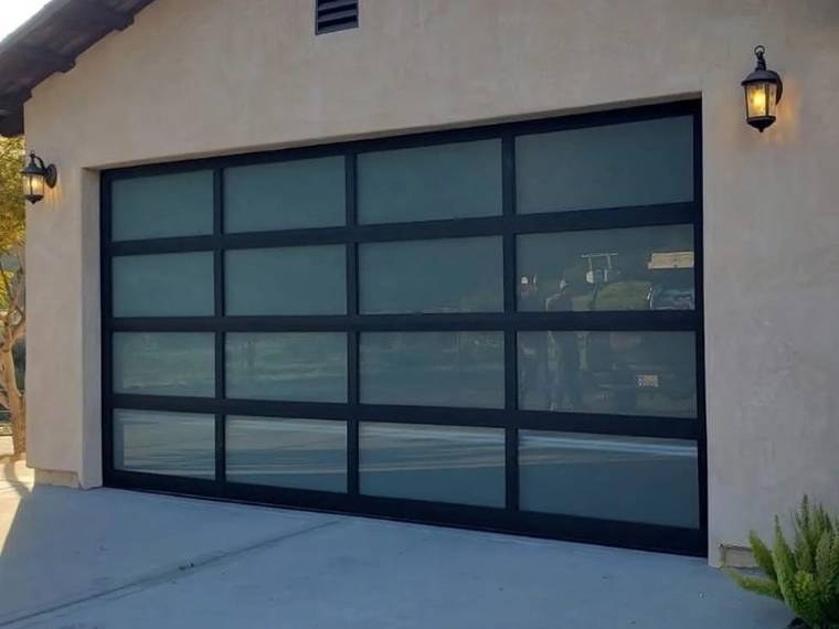 Full-view garage door with a black frame and frosted glass &mdash; installed and serviced by Riverside Classic Garage Doors across Riverside County, California
