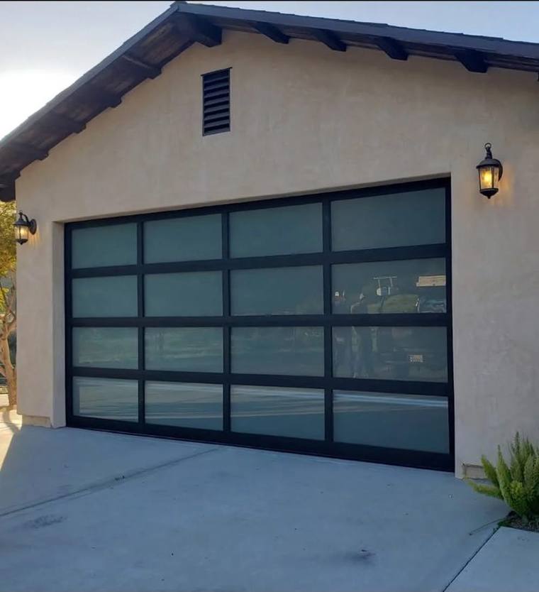 Full-view aluminium and frosted glass garage door with black frame