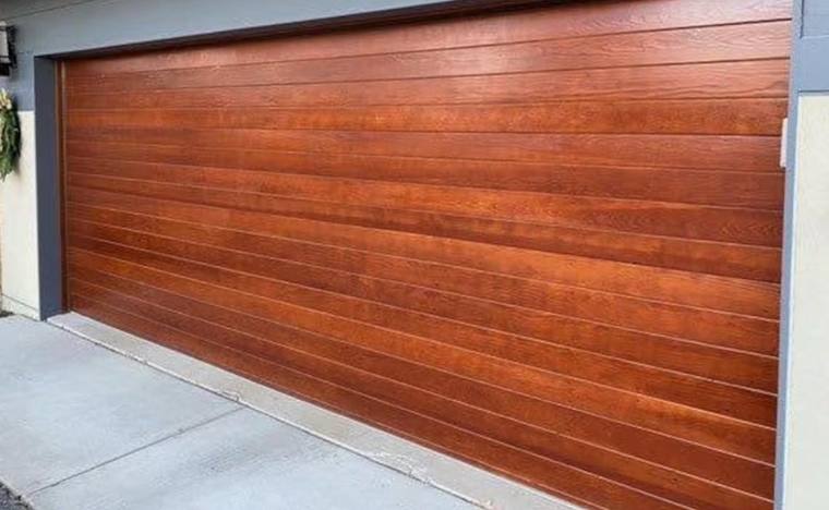 Mahogany-stained horizontal plank garage door